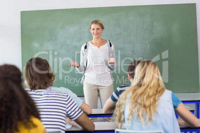 Teacher teaching students in class