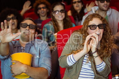 Young friends watching a 3d film