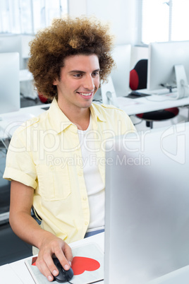 Smiling male student in computer class Smiling male student in computer class