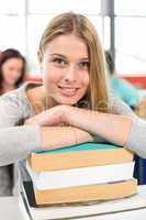 Smiling female student in classroom