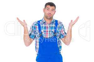 Confused handyman giving I dont know gesture