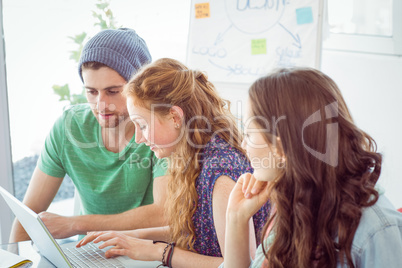 Fashion students looking at computer