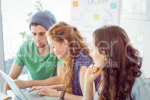 Fashion students looking at computer