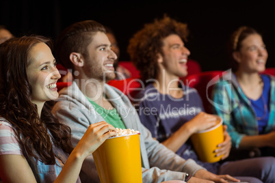 Young couple watching a film