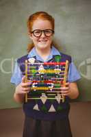 Portrait of cute little girl holding abacus