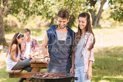 Happy friends in the park having lunch