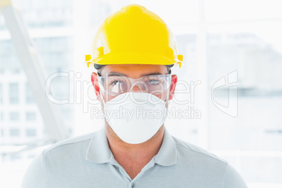 Confident handyman wearing protective workwear