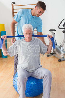 Senior man training with his coach