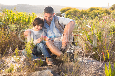 Father and son hiking in the mountains