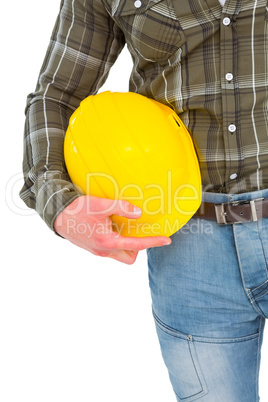 Manual worker holding helmet