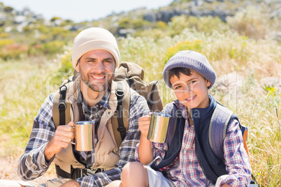 Father and son hiking in the mountains