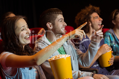 Young friends watching a film Young friends watching a film