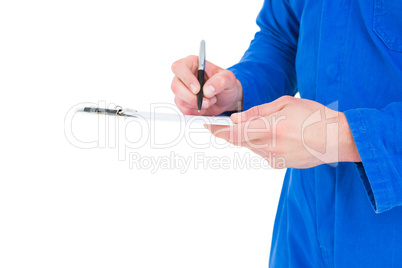 Mechanic writing on clipboard Mechanic writing on clipboard
