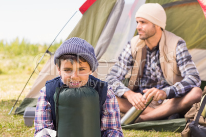 Father and son in their tent