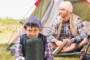 Father and son in their tent