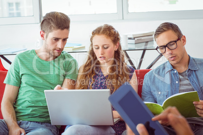 Fashion students looking at computer