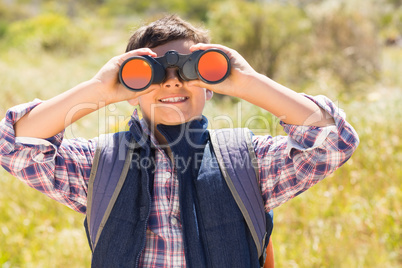 Little boy hiking in the mountains