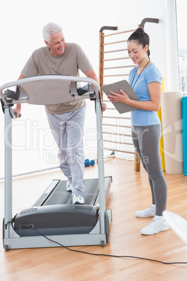 Senior man working out with his trainer