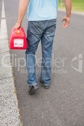 Man bringing petrol canister to a broken down car