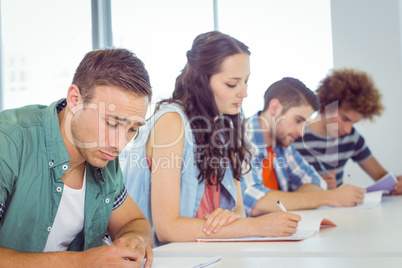 Fashion students taking notes in class
