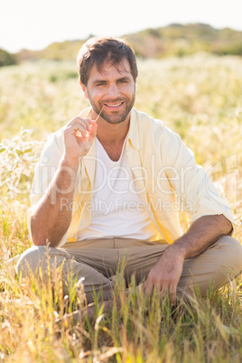 Happy man smiling at camera