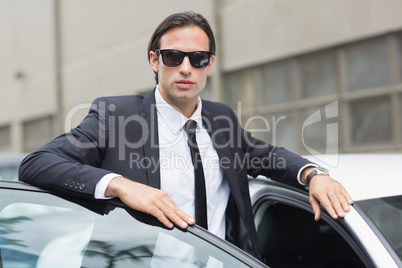 Businessman leaning on the door Businessman leaning on the door