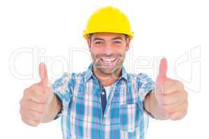 Smiling manual worker gesturing thumbs up