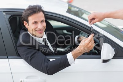 Businessman sitting in drivers seat