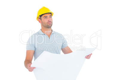 Thoughtful male architect holding blueprint