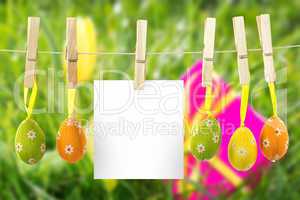 Composite image of hanging easter eggs