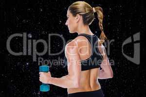 Composite image of female bodybuilder holding a blue dumbbell