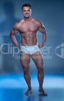 Muscular Man in White Boxer Shorts Looking Down