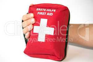 First aid kit with hand - english and german tittle