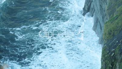 Wave breaking against cliff in Ireland