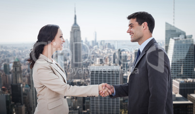 Composite image of future partners shaking hands