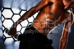Composite image of mid section of fit shirtless young man liftin