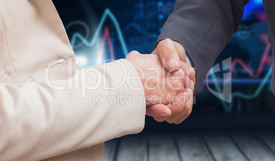 Composite image of business people shaking hands