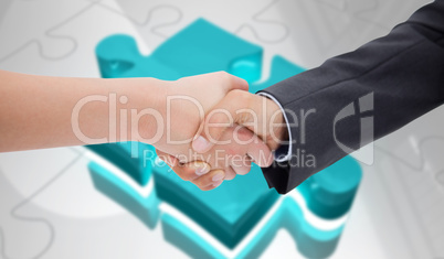 Composite image of close up of a handshake