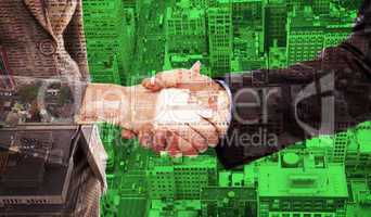 Composite image of close up of two businesspeople shaking their