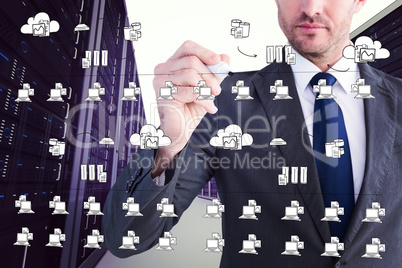 Composite image of serious businessman writing with marker