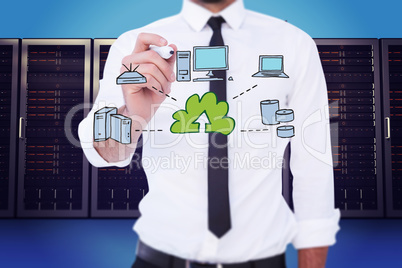 Composite image of focused businessman writing with marker