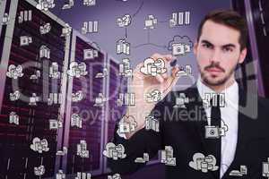 Composite image of serious businessman writing with marker