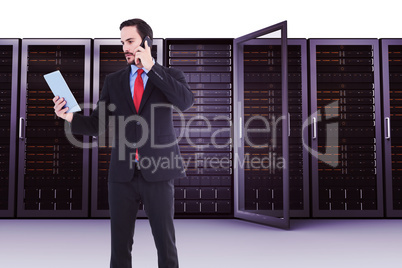 Composite image of businessman talking on phone holding tablet p