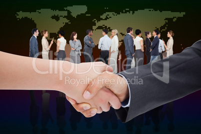 Composite image of close up of a handshake