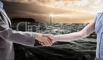 Composite image of handshake between two women