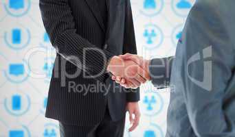 Composite image of business people shaking hands