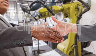 Composite image of businessman going shaking a hand Composite image of businessman going shaking a hand
