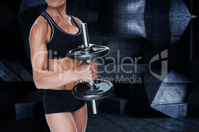 Composite image of female strong bodybuilder holding large black