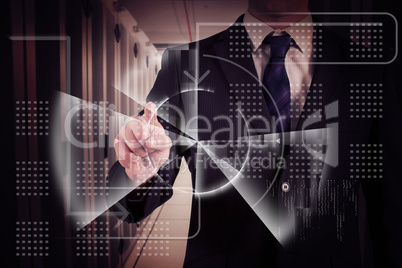 Composite image of businessman in suit pointing finger