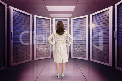 Composite image of businesswoman standing back to camera